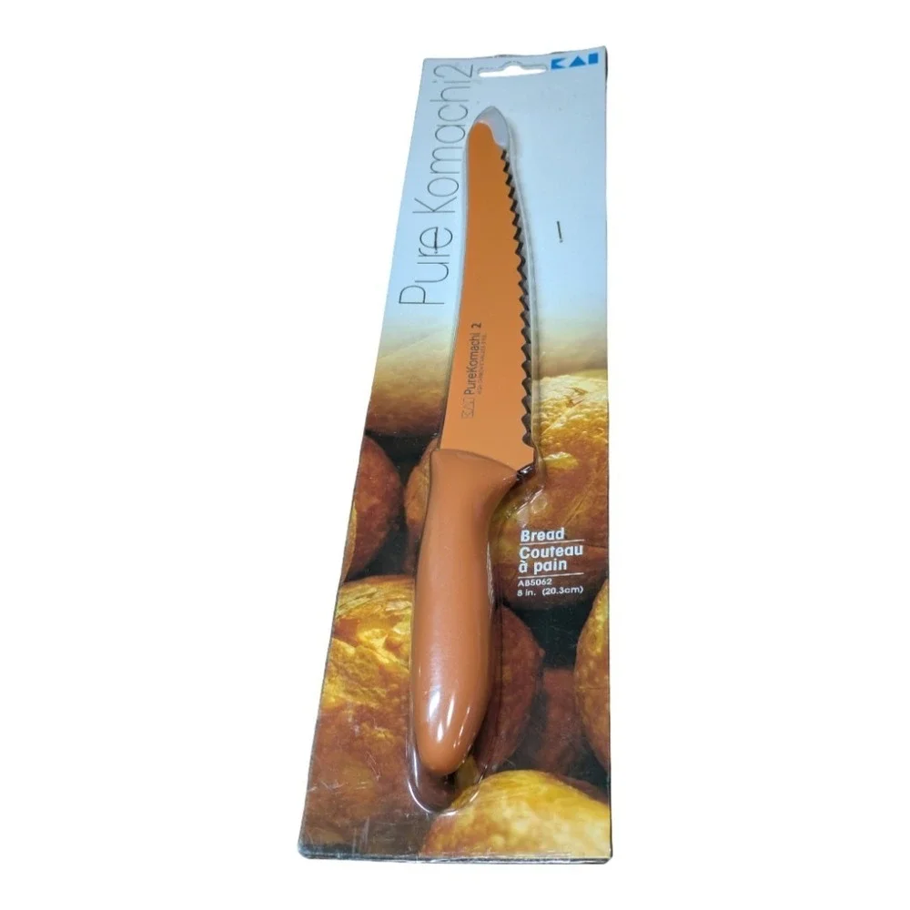 Kai Pure Komachi 2 series 8-inch serrated bread knife in orange.